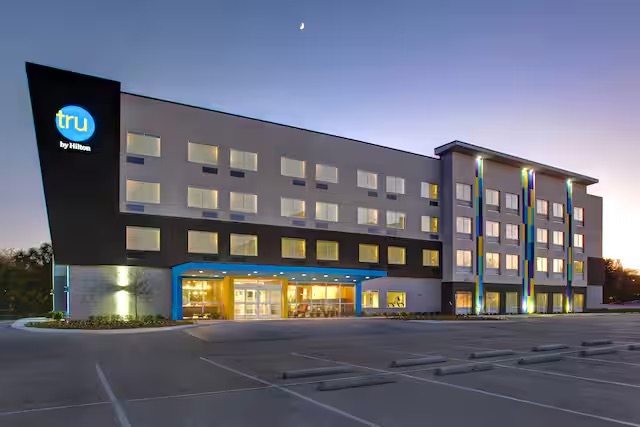 Tru by Hilton exterior lit at dusk
